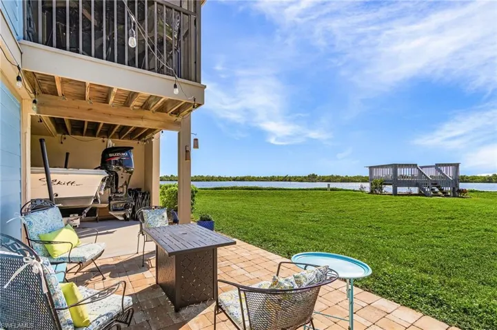 View of patio / terrace with a water view and stairs