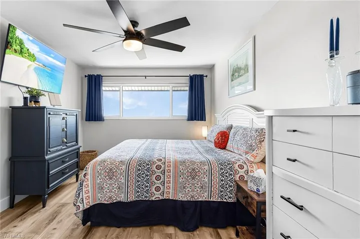 Bedroom featuring light wood-style floors and a ceiling fan
