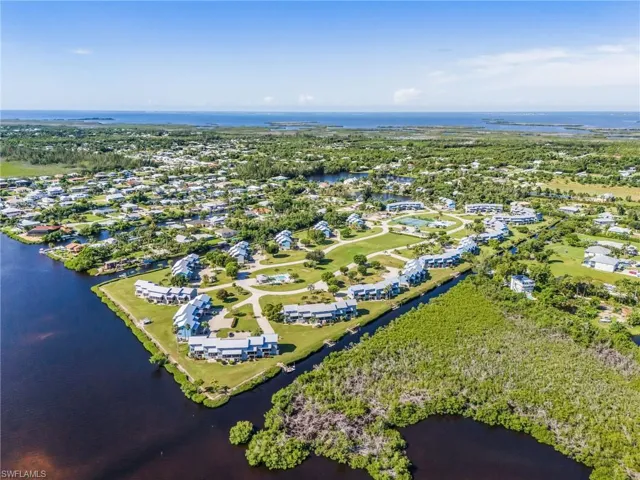 Aerial view of residential area with a large body of water