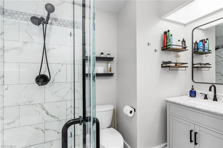 Bathroom with vanity and a shower stall