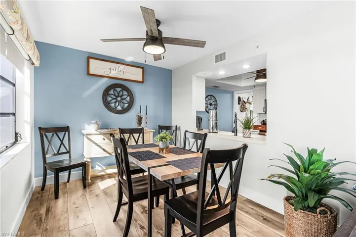 Dining room featuring light wood-type flooring and ceiling fan
