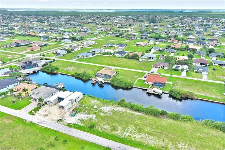 View of property location featuring nearby suburban area and a large body of water