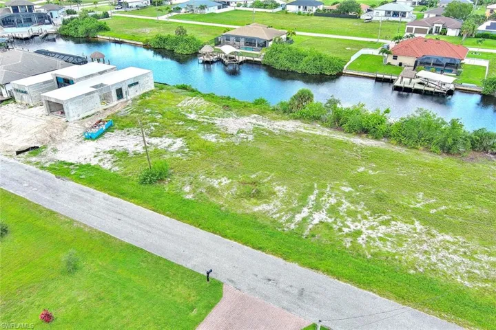 Aerial perspective of suburban area with a large body of water