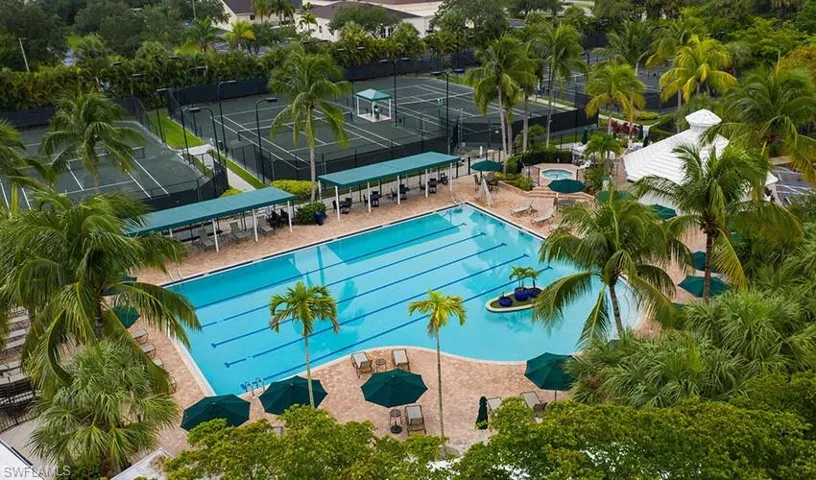 Community pool with a patio