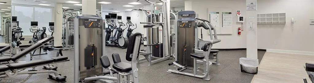 Workout area featuring a drop ceiling