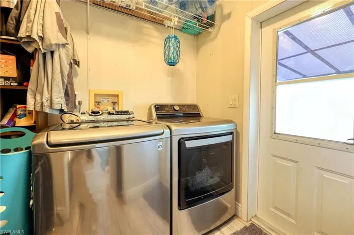 Laundry area with independent washer and dryer and a healthy amount of sunlight