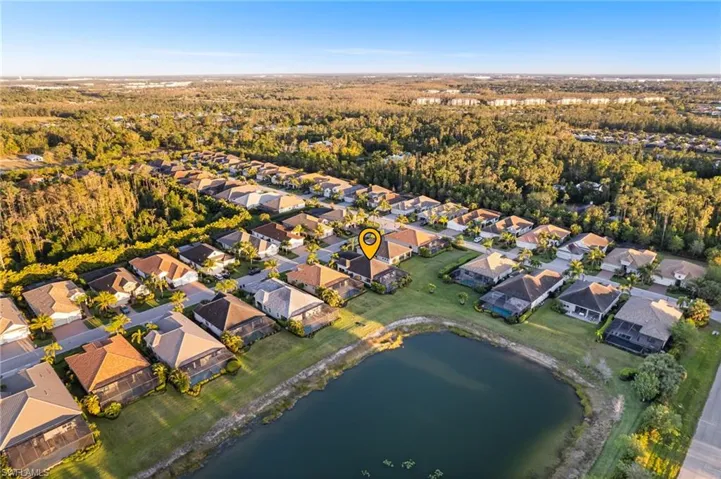 Aerial view featuring a residential view and a water view