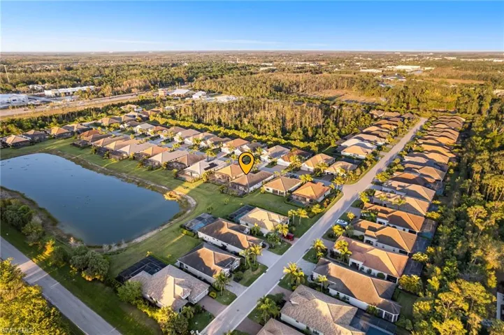 Drone / aerial view with a residential view and a water view