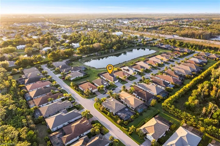 Drone / aerial view with a residential view and a water view