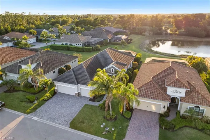 Drone / aerial view with a residential view and a water view