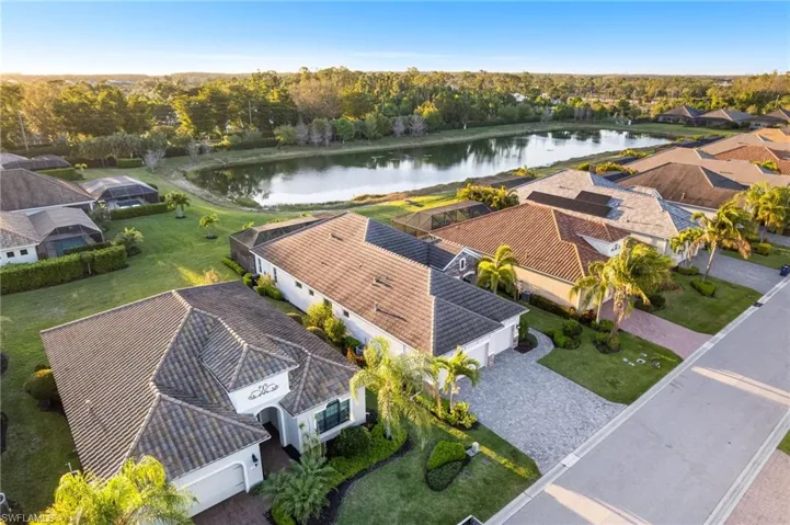 Drone / aerial view with a water view and a residential view