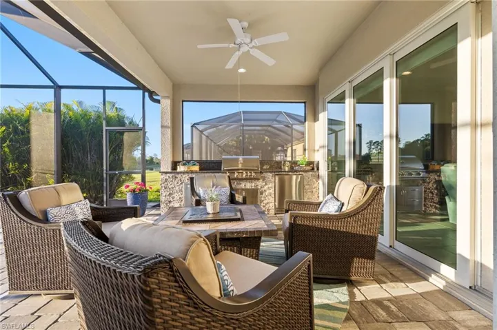 Sunroom featuring ceiling fan