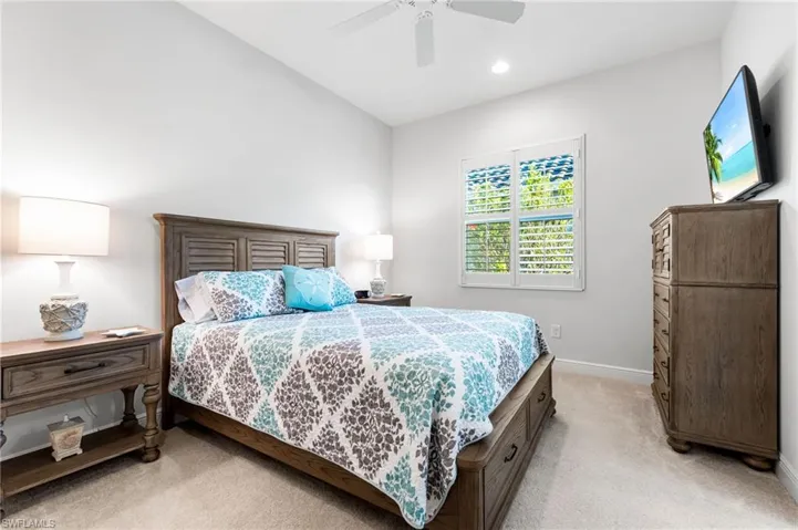 Bedroom with recessed lighting, light colored carpet, baseboards, and ceiling fan