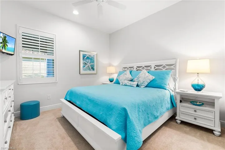 Carpeted bedroom with recessed lighting, baseboards, and a ceiling fan
