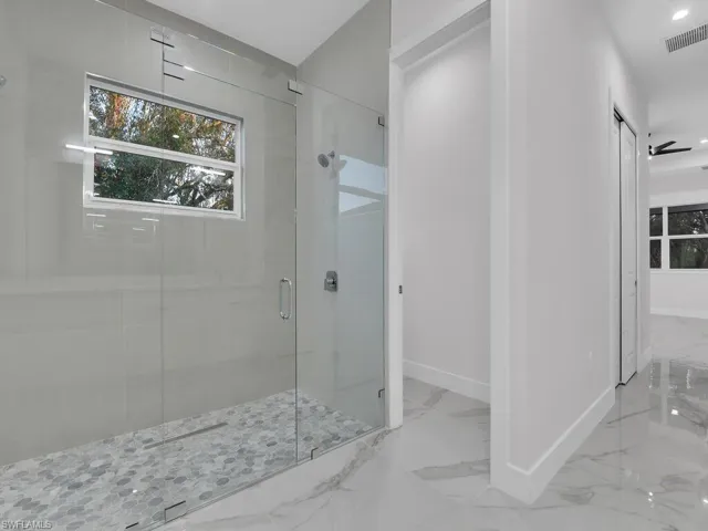 Bathroom with a shower with shower door