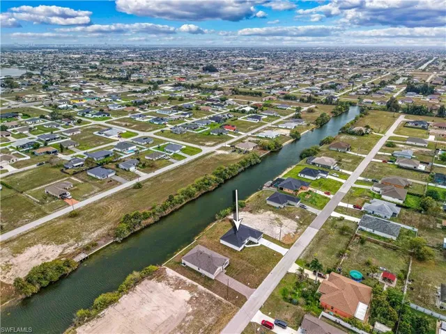 View of property location with nearby suburban area and a large body of water