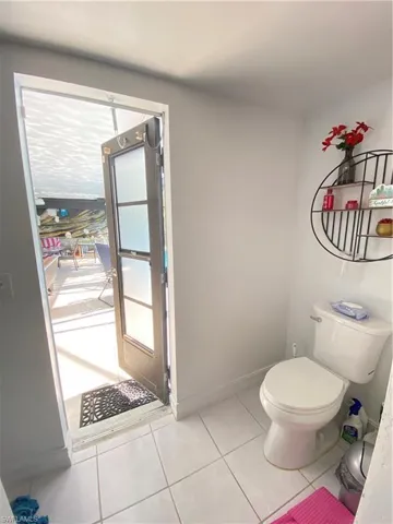 Bathroom featuring tile patterned flooring and toilet
