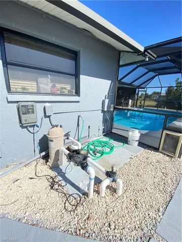 View of swimming pool with glass enclosure