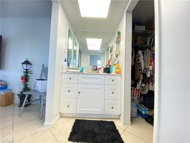 Bathroom with tile patterned flooring and vanity