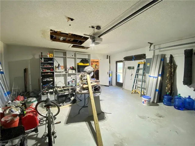 Garage featuring a garage door opener