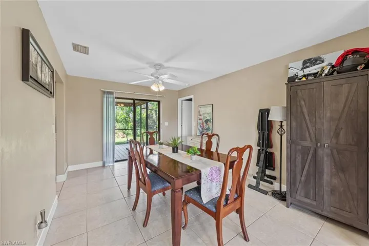 Tiled dining area with ceiling fan