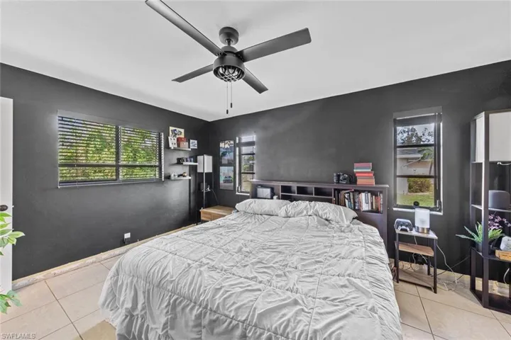 Bedroom featuring ceiling fan and light tile patterned flooring