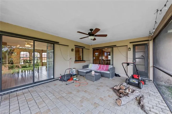 View of patio / terrace with an outdoor living space and ceiling fan