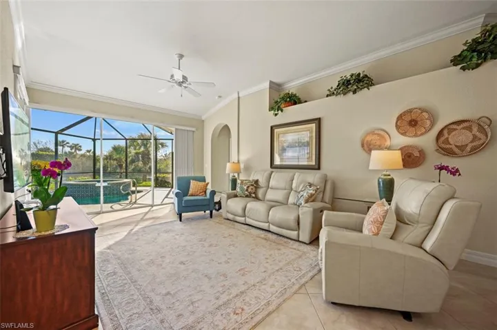 Open living room with beautiful lanai focal point and plenty of natural light