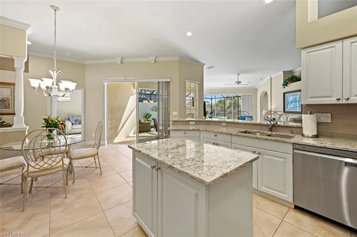 View of the kitchen looking out to the living area and lanai entry