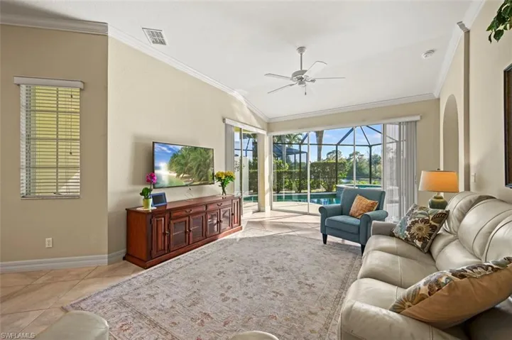 Open living room with beautiful lanai focal point and plenty of natural light.