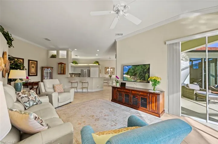 View of the living room looking back toward the kitchen and dining area