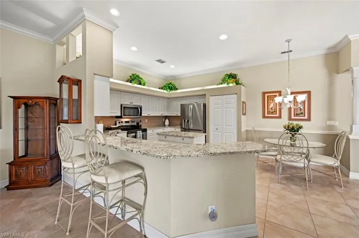 View of the kitchen and raised bar seating