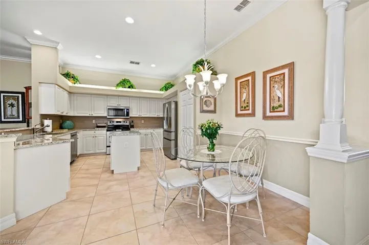 Kitchen and dining area with updated 20' porcelain tile