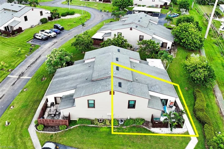 Aerial view of property and surrounding area featuring property boundaries highlighted