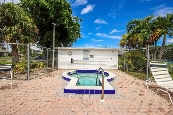 View of pool featuring a hot tub