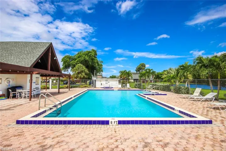 Community pool featuring a patio
