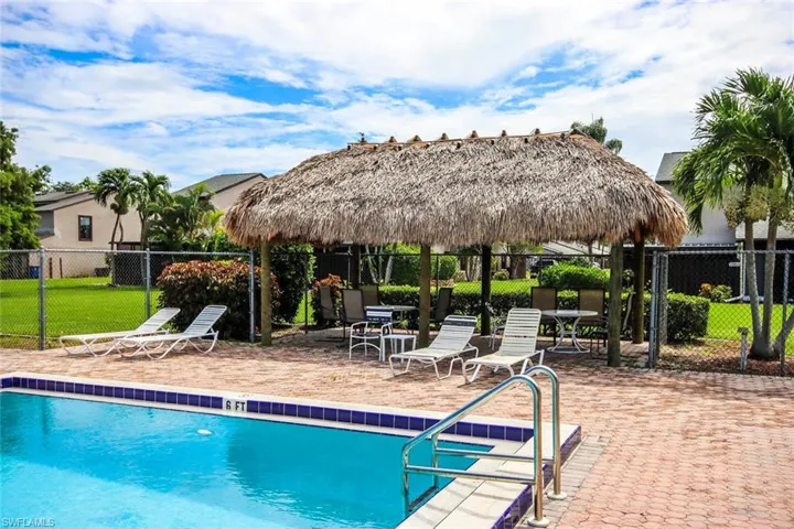 Community pool with a gazebo and a patio