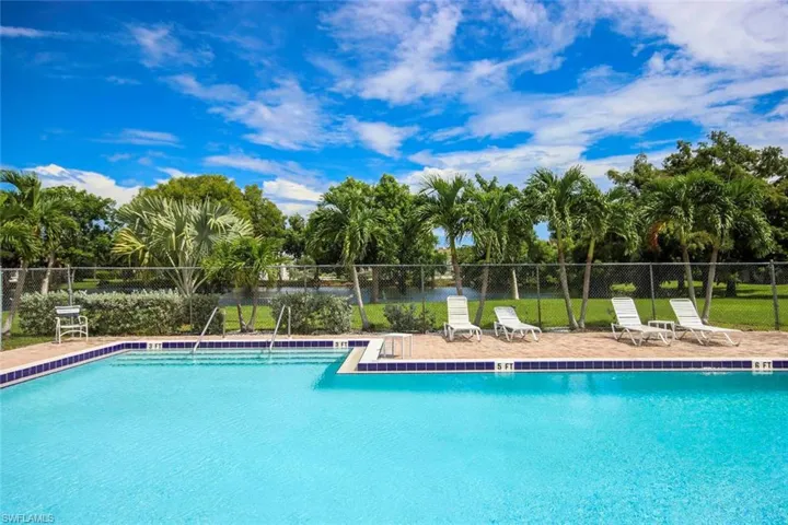 Community pool with a patio area