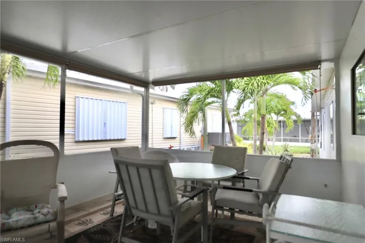 Sunroom / solarium featuring a healthy amount of sunlight