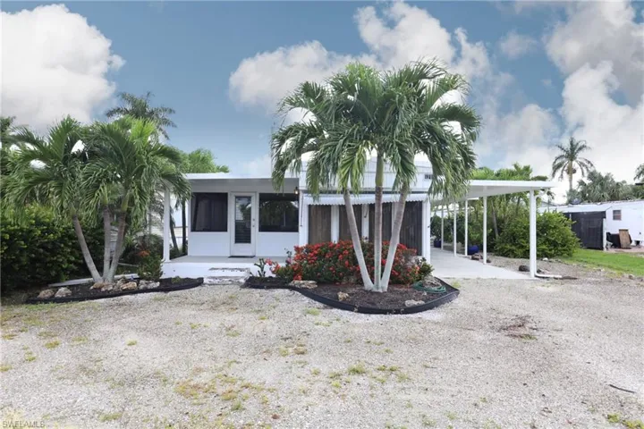 View of front of house featuring a carport