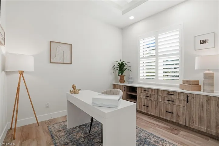 Private home office, built in cabinetry, double french door entry
