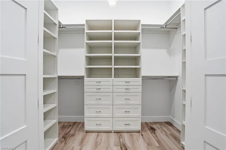 One of 2 walk in closets with built ins