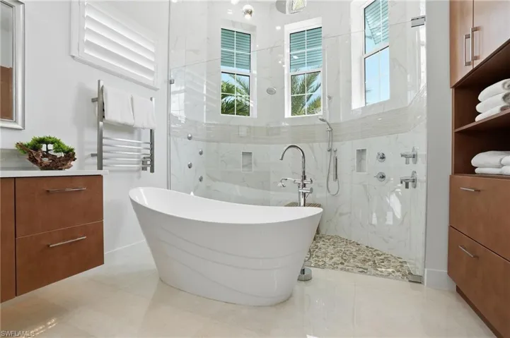 Dual vanities, custom cabinetry, soaking tub