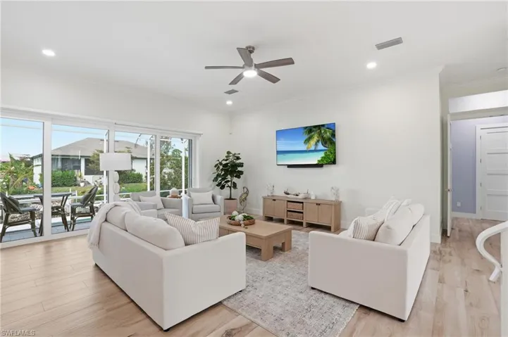 Pocketing sliders, motorized window treatments, overlooking pool, waterfront