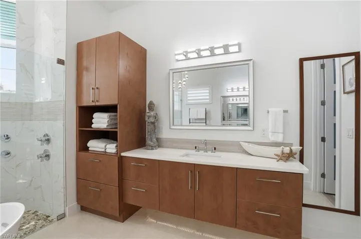Designer finishes, under cabinetry lighting, dual vanities