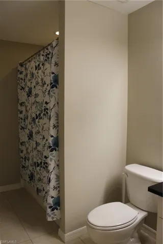 Secondary Bathroom, Tub Shower Combo with Laundry in Closet