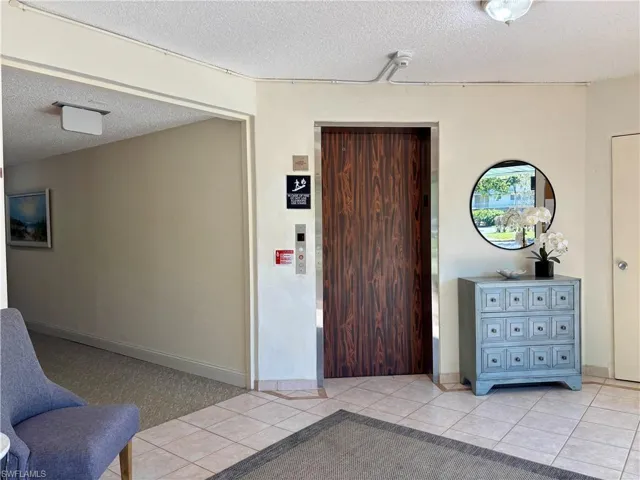 Property entrance featuring elevator