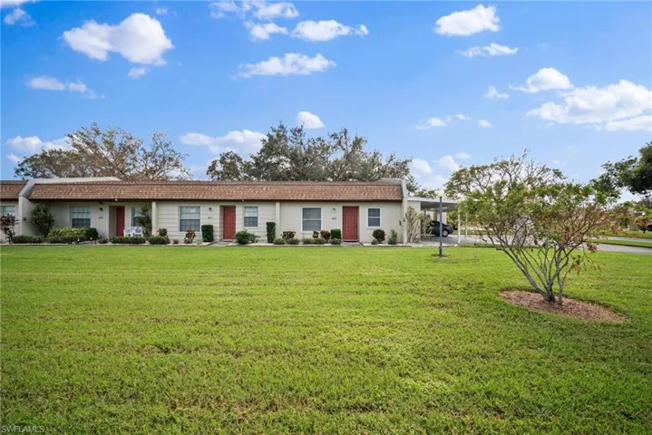 Ranch-style home with a front yard