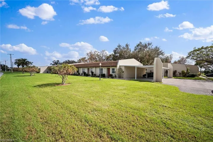 View of front of property with a front yard