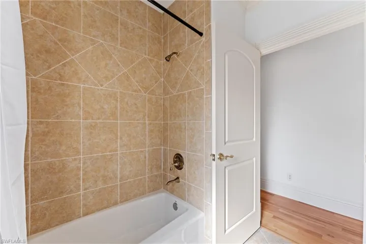 Bathroom with shower / tub combo with curtain